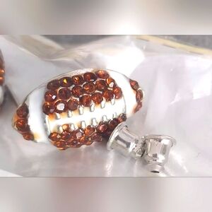 NWT packaged rhinestone football earrings. New!